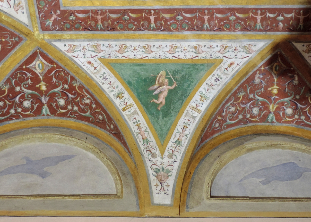 Putto alato con attributi (decorazione pittorica) di Giulio Romano, Anselmo Guazzi (secondo quarto sec. XVI)