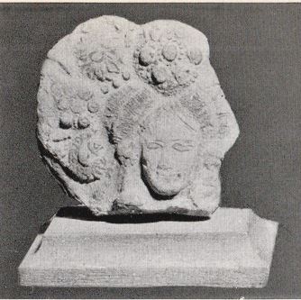 testa femminile e decorazioni fitomorfe (rilievo) - manifattura cinese (I a.C)