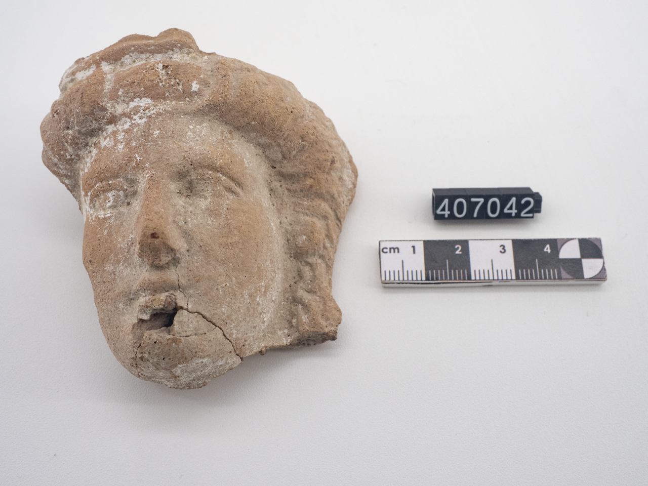 statuetta, testa (SECOLI/ IV a.C)