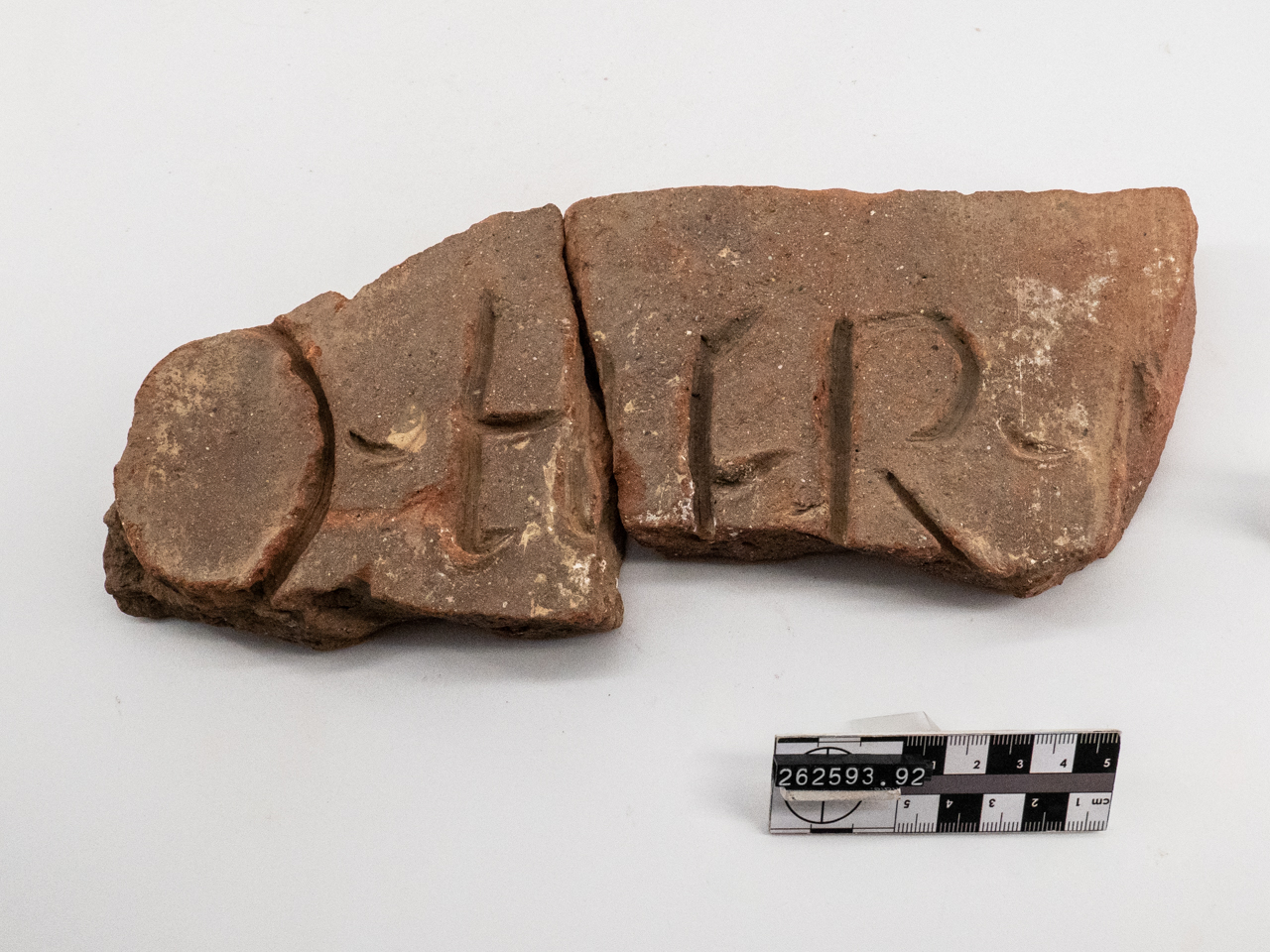 mattone/ con bollo, frammento (non determinabile)