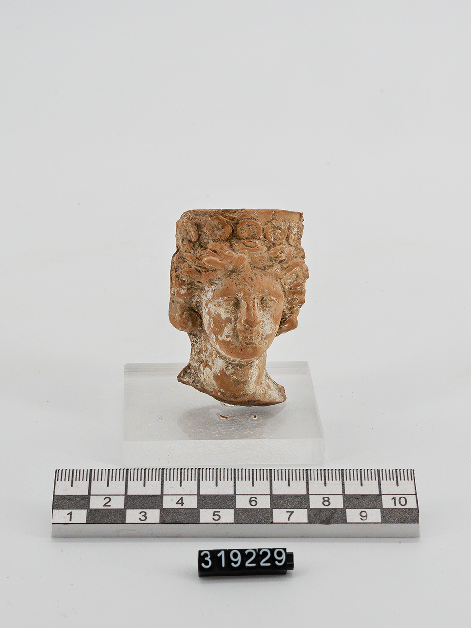 statuetta/ femminile, testa - produzione magnogreca (IV a.C)