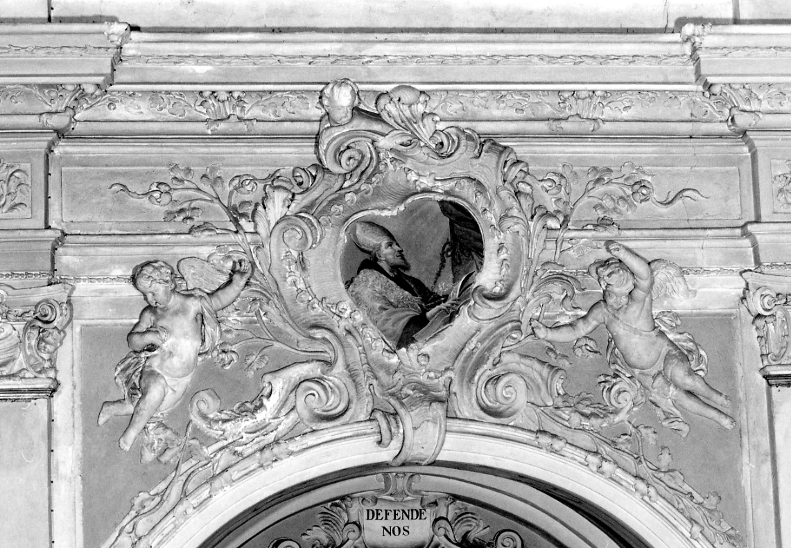 motivi decorativi vegetali con angeli reggicartiglio e testa di putto (decorazione plastica) di Beltramelli Domenico (fine/inizio secc. XVII/ XVIII)