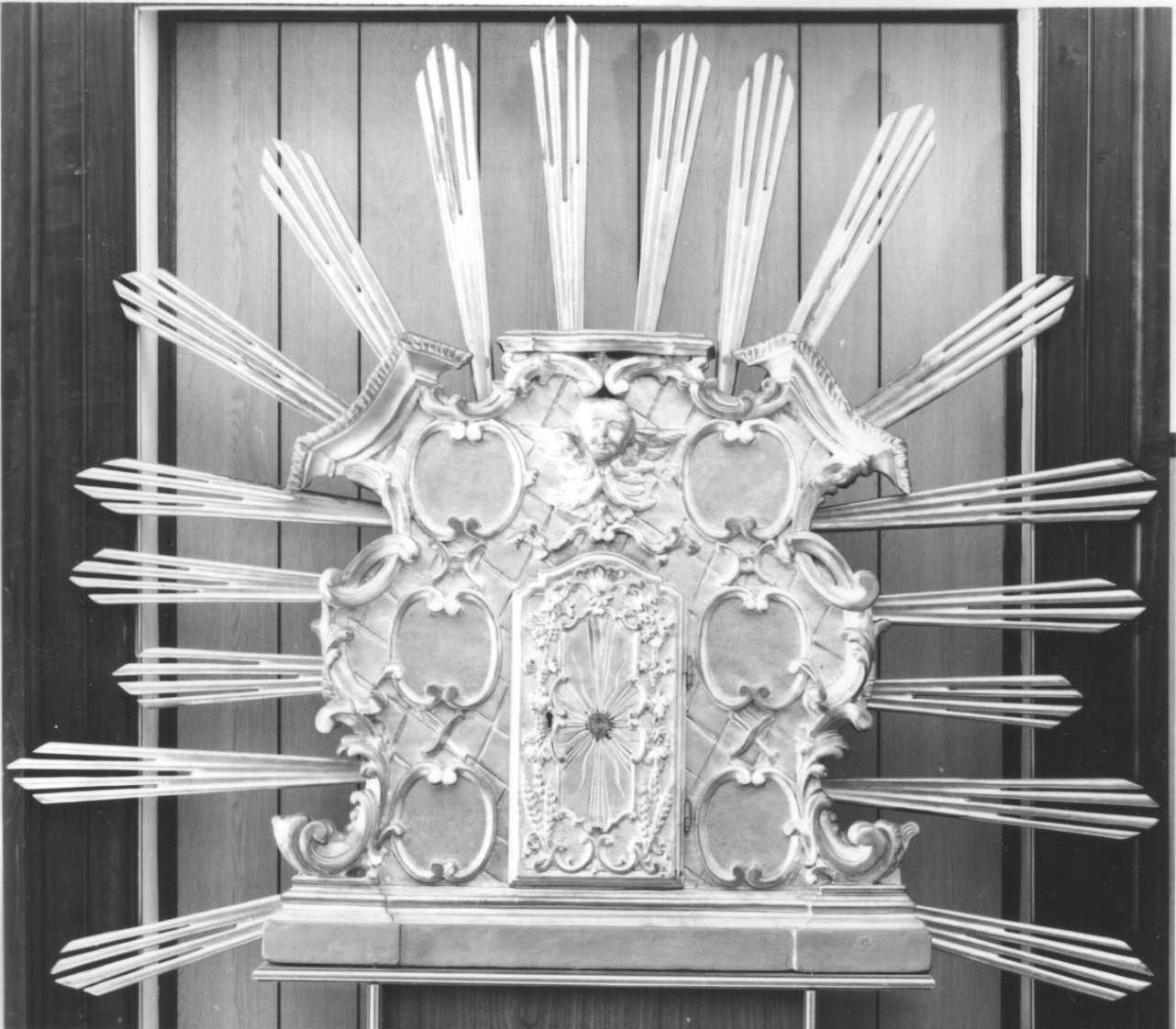 TESTA DI CHERUBINO CON MOTIVI DECORATIVI VEGETALI A VOLUTE (tabernacolo portatile, opera isolata) - ambito piemontese (fine/inizio secc. XVII/ XVIII)